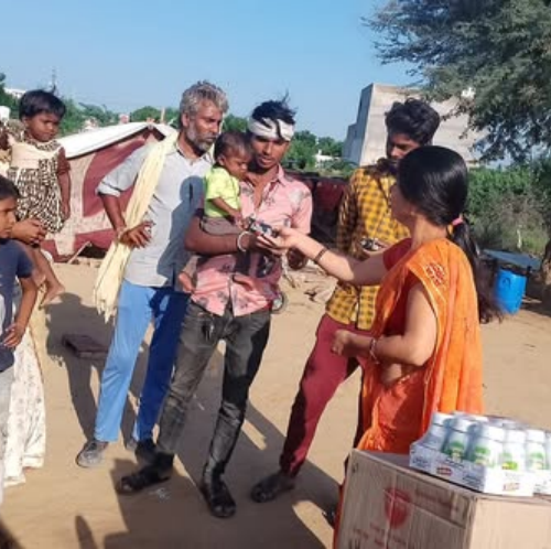 Nutritious Apple Juice & Hajmola Distribution Program